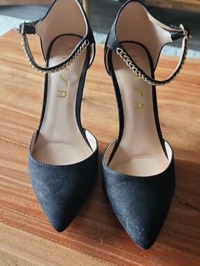Unisa Black Suede Pointed Toe Ankle-Strap Heels with Gold Chain
